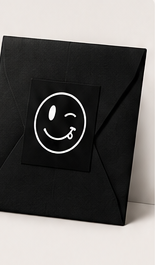 Black Someone Said envelope with the wink logo